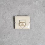 COACH BEIGE BUCKLE FLAP BIFOLD WALLET